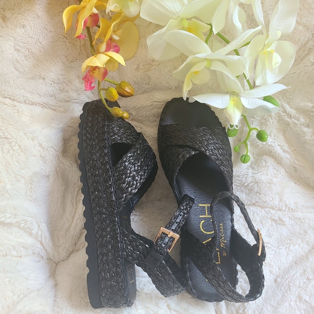 Nwot! Braided raffia sandal with buckle closure.